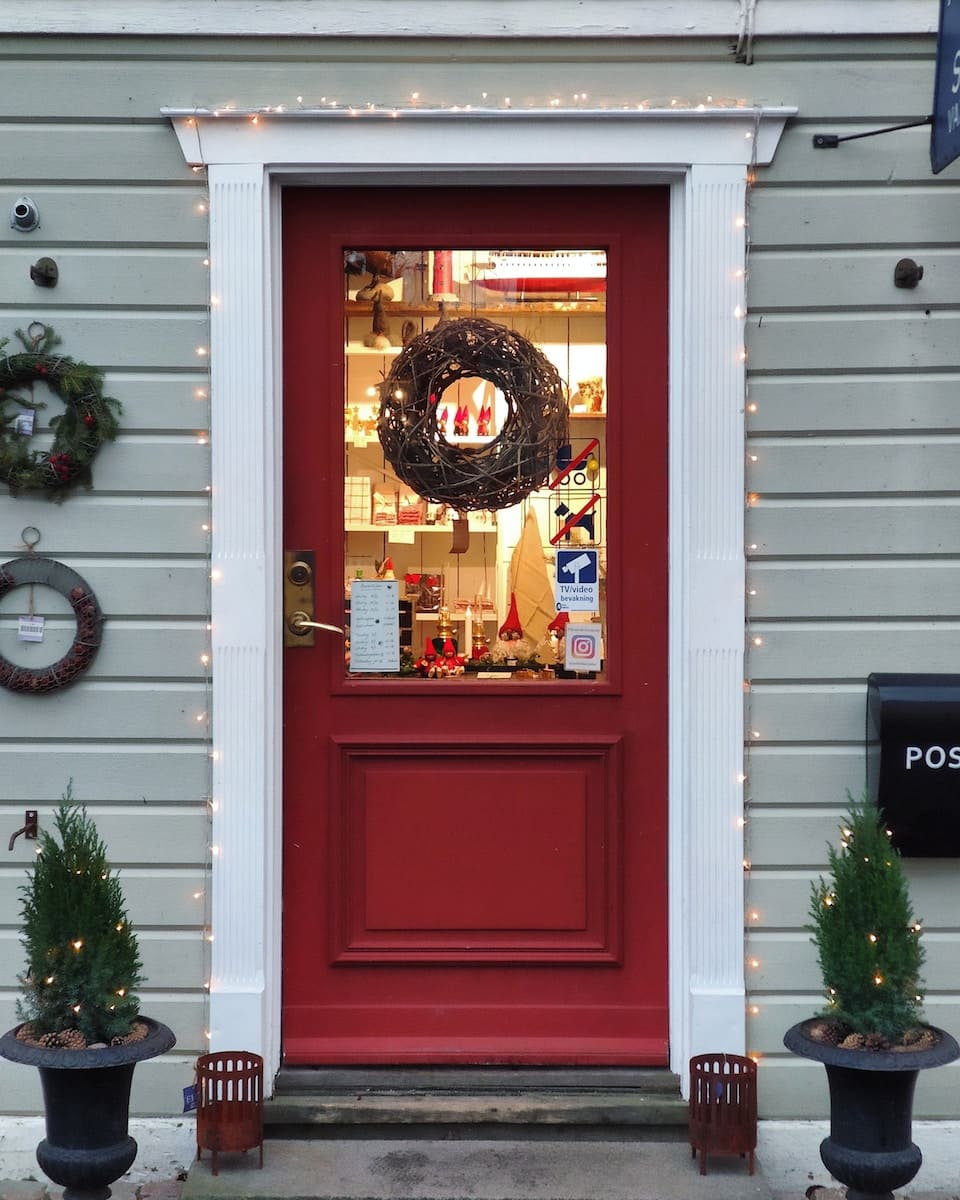 red wooden storm glass door - outdoor christmas decorating ideas